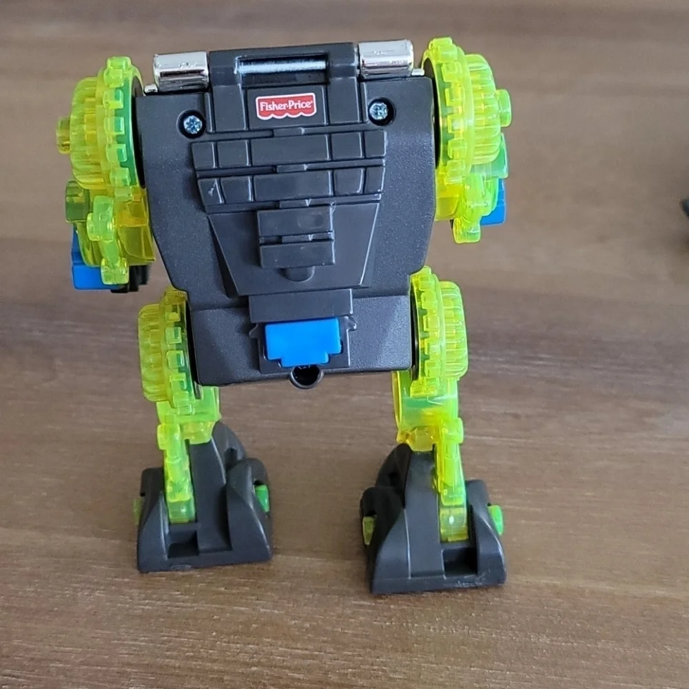 Fisher-Price Imaginext Raptor Doc & Exo Suit Dinosaur Figure Toy Set